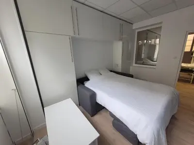 Un ou plusieurs lits dans un hébergement de l'établissement Studio bien équipé au calme à Montmartre