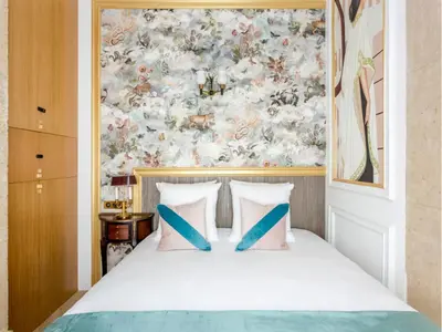 Un ou plusieurs lits dans un hébergement de l'établissement Merveil -Luxury Suite -Champs Elysees-Haussmann II