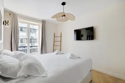Un ou plusieurs lits dans un hébergement de l'établissement Pick A Flat's Apartments in Saint-Lazare - Rue de Londres