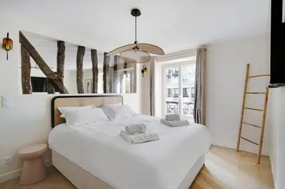 Un ou plusieurs lits dans un hébergement de l'établissement Pick A Flat's Apartments in Saint-Lazare - Rue de Londres