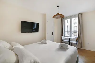 Un ou plusieurs lits dans un hébergement de l'établissement Pick A Flat's Apartments in Saint-Lazare - Rue de Londres