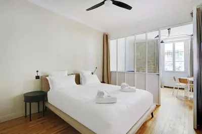 Un ou plusieurs lits dans un hébergement de l'établissement Pick A Flat's Apartment in Opéra - Rue Saulnier