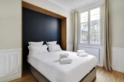 Un ou plusieurs lits dans un hébergement de l'établissement Pick A Flat's Apartment in Opéra - Rue Saulnier
