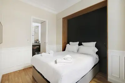 Un ou plusieurs lits dans un hébergement de l'établissement Pick A Flat's Apartment in Opéra - Rue Saulnier