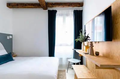 Un ou plusieurs lits dans un hébergement de l'établissement Baba Hotel
