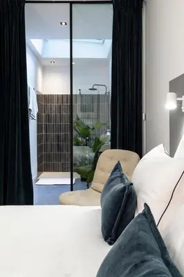 Un ou plusieurs lits dans un hébergement de l'établissement Baba Hotel