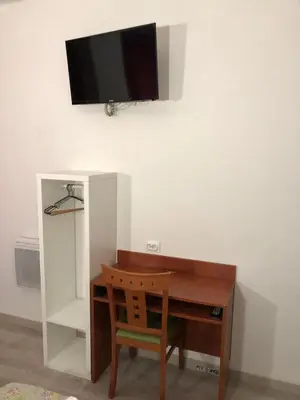 Télévision ou salle de divertissement dans l'établissement Hôtel Central Bastille