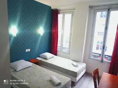 Un ou plusieurs lits dans un hébergement de l'établissement Hôtel Central Bastille