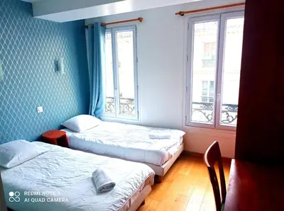 Un ou plusieurs lits dans un hébergement de l'établissement Hôtel Central Bastille