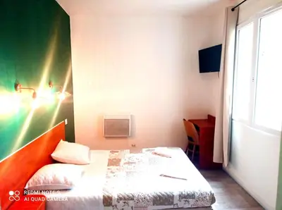 Un ou plusieurs lits dans un hébergement de l'établissement Hôtel Central Bastille