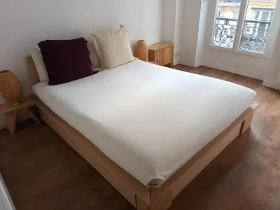 Un ou plusieurs lits dans un hébergement de l'établissement APPARTEMENT SACRE COEUR