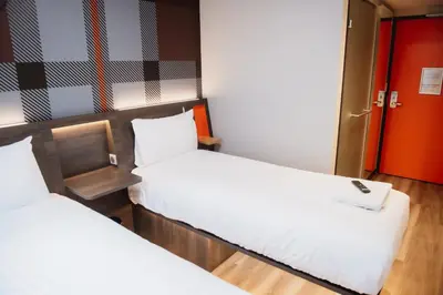 Un ou plusieurs lits dans un hébergement de l'établissement easyHotel Paris Nord Aubervilliers