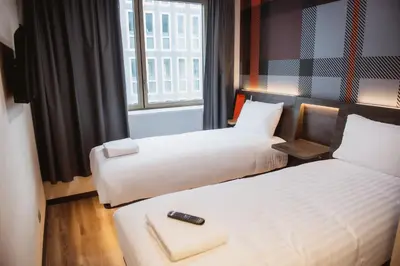 Un ou plusieurs lits dans un hébergement de l'établissement easyHotel Paris Nord Aubervilliers
