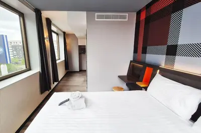 Un ou plusieurs lits dans un hébergement de l'établissement easyHotel Paris Nord Aubervilliers