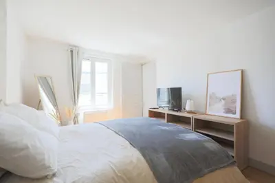 Un ou plusieurs lits dans un hébergement de l'établissement 123paris city