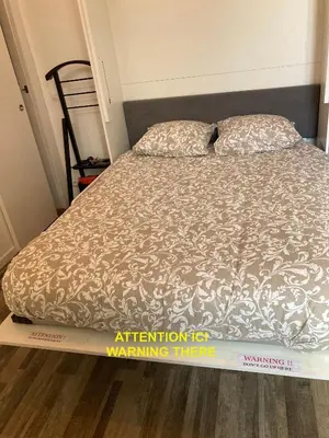 Un ou plusieurs lits dans un hébergement de l'établissement Cosy nest from 10 minutes PARIS centre