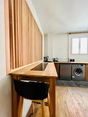 Coin salon dans l'établissement Joli Appartement à 15min des Champs Elysée