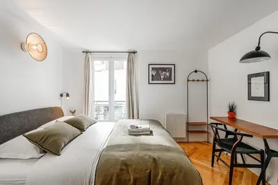 Un ou plusieurs lits dans un hébergement de l'établissement Appartement Grenelle - Welkeys