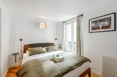Un ou plusieurs lits dans un hébergement de l'établissement Appartement Grenelle - Welkeys