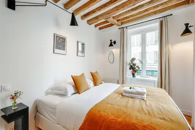 Un ou plusieurs lits dans un hébergement de l'établissement Appartement Grenelle - Welkeys
