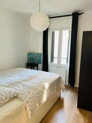 Un ou plusieurs lits dans un hébergement de l'établissement Appart PARIS Sud - calme & lumineux - RER B 2 minutes