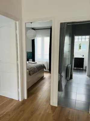 Un ou plusieurs lits dans un hébergement de l'établissement Appart PARIS Sud - calme & lumineux - RER B 2 minutes
