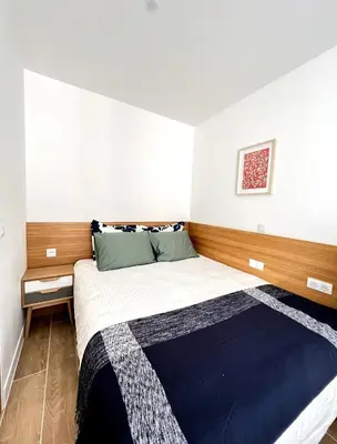 Un ou plusieurs lits dans un hébergement de l'établissement New Inn Paris