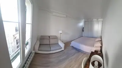 Un ou plusieurs lits dans un hébergement de l'établissement Appartement luxueux dans maison bourgeoise parisienne