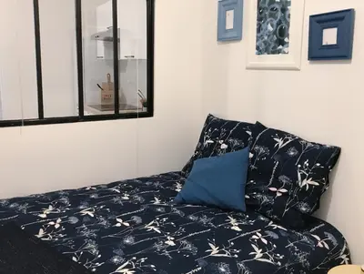 Un ou plusieurs lits dans un hébergement de l'établissement Appartements Au Coeur du Marais