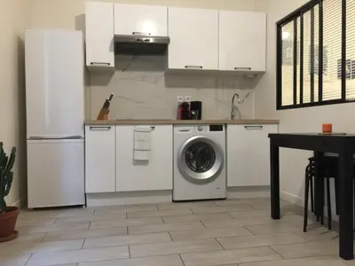 Cuisine ou kitchenette dans l'établissement Appartements Au Coeur du Marais