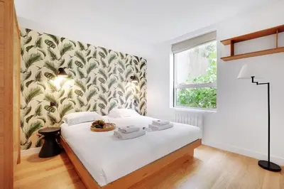 Un ou plusieurs lits dans un hébergement de l'établissement Superbe Appartement - Père Lachaise