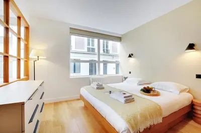 Un ou plusieurs lits dans un hébergement de l'établissement Superbe Appartement - Père Lachaise