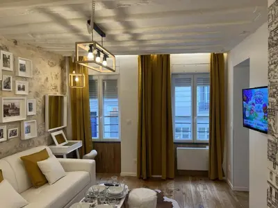 Télévision ou salle de divertissement dans l'établissement Villette & Canal - Apartment