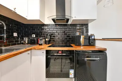 Cuisine ou kitchenette dans l'établissement STUDIO PANTHEON