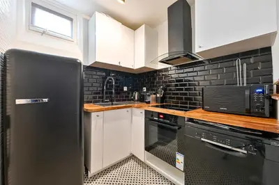 Cuisine ou kitchenette dans l'établissement STUDIO PANTHEON