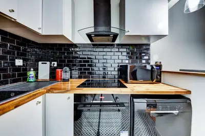 Cuisine ou kitchenette dans l'établissement STUDIO PANTHEON
