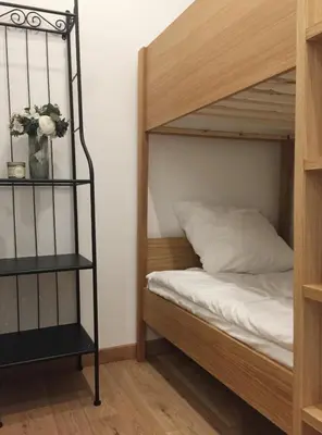 Un ou plusieurs lits dans un hébergement de l'établissement Appartement Familial Au Coeur du Marais