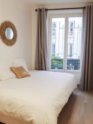 Un ou plusieurs lits dans un hébergement de l'établissement New Apartment in the Heart of Le Marais