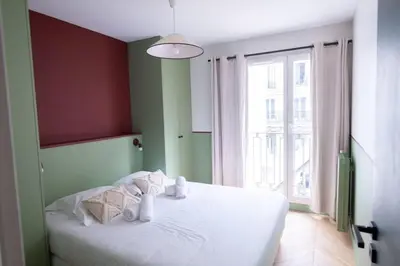 Un ou plusieurs lits dans un hébergement de l'établissement Recently renovated 3BD next to Invalides