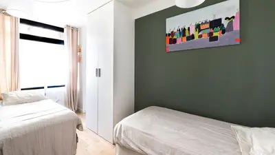 Un ou plusieurs lits dans un hébergement de l'établissement Bright & renovated 3BD for 8 guests in Le Marais!