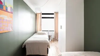 Un ou plusieurs lits dans un hébergement de l'établissement Bright & renovated 3BD for 8 guests in Le Marais!