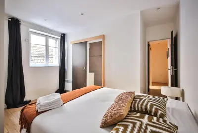 Un ou plusieurs lits dans un hébergement de l'établissement 02#Duplex 2Bedrooms#Sèvres Lecourbe#Necker