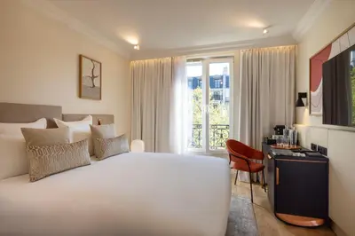 Un ou plusieurs lits dans un hébergement de l'établissement Alberte Hôtel