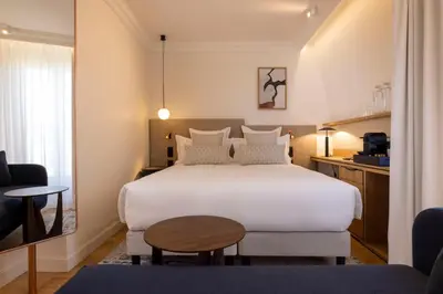 Un ou plusieurs lits dans un hébergement de l'établissement Alberte Hôtel
