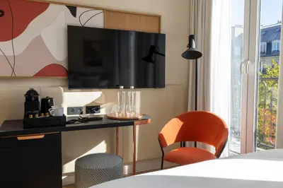 Télévision ou salle de divertissement dans l'établissement Alberte Hôtel