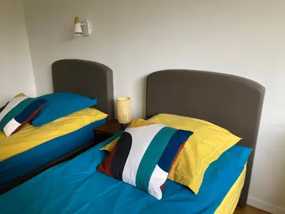 Un ou plusieurs lits dans un hébergement de l'établissement Vue sur jardin, 3 pièces