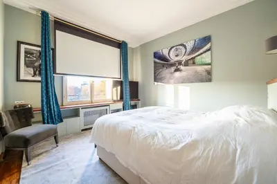 Un ou plusieurs lits dans un hébergement de l'établissement Spacieux et élégant appartement Porte des ternes