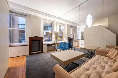 Coin salon dans l'établissement Élégant studio avec mezzanine porte des Ternes