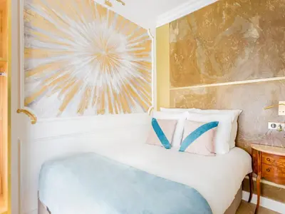 Un ou plusieurs lits dans un hébergement de l'établissement Merveil - Luxury Suite -Champs Elysees-Haussmann I