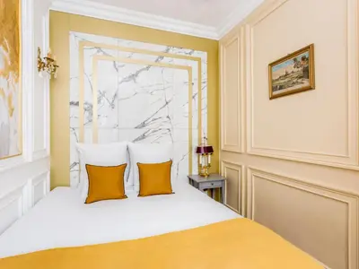 Un ou plusieurs lits dans un hébergement de l'établissement Merveil - Luxury Suite -Champs Elysees-Haussmann I